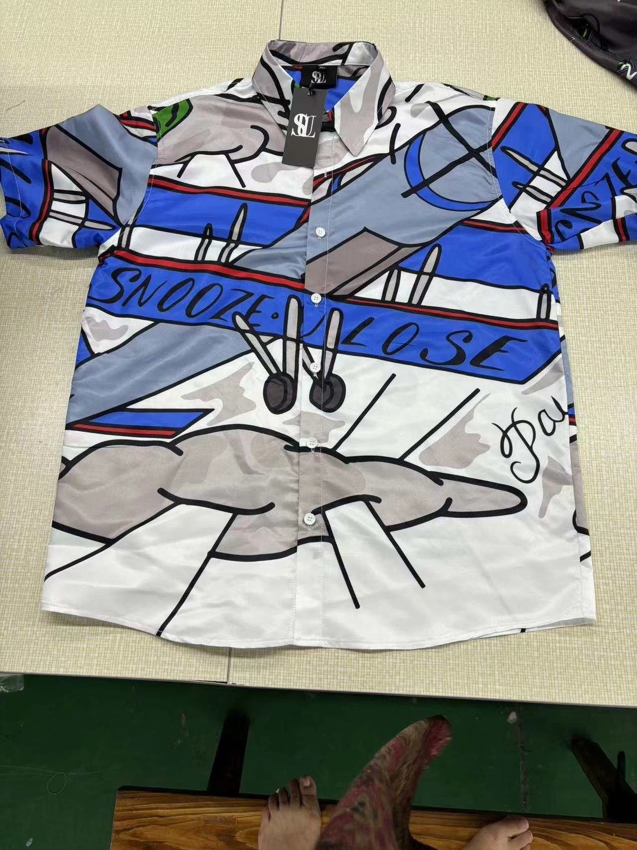 SUL short sleeve shirt with blue and grey abstract line artwork