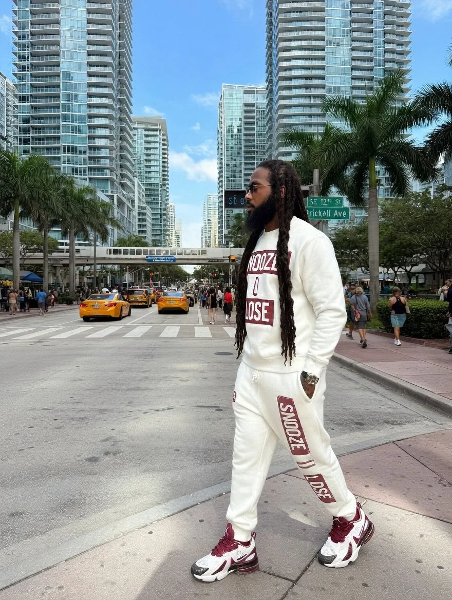 SUL white and maroon sweatsuit worn on a city street