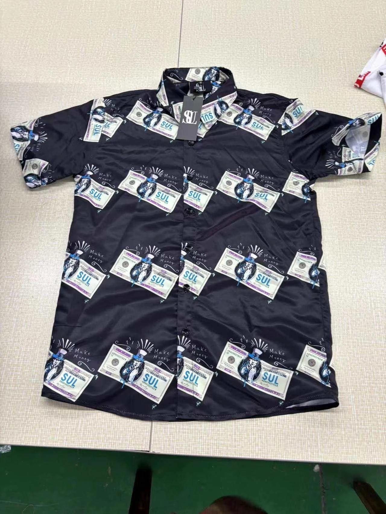 Black SUL short sleeve shirt with banknote graphics and lettering