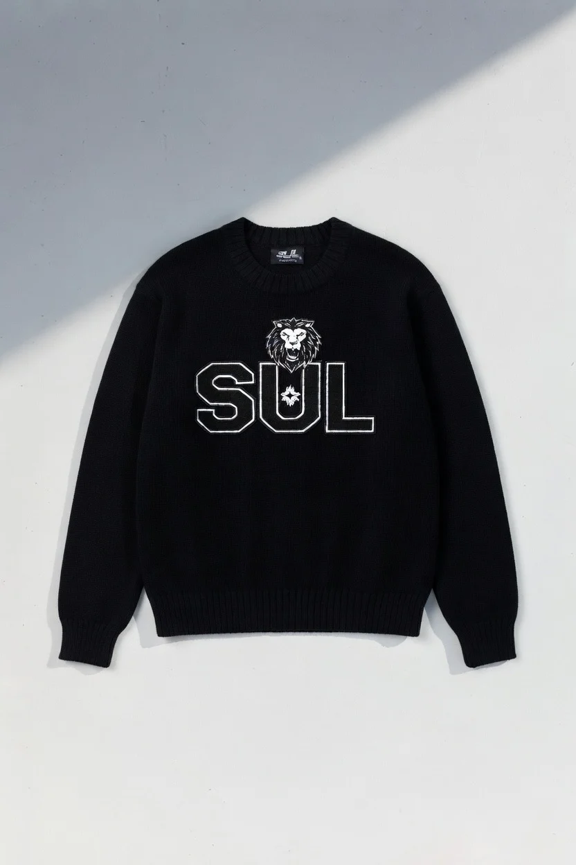 Black crewneck sweater with outlined SUL lettering and embroidered lion crest