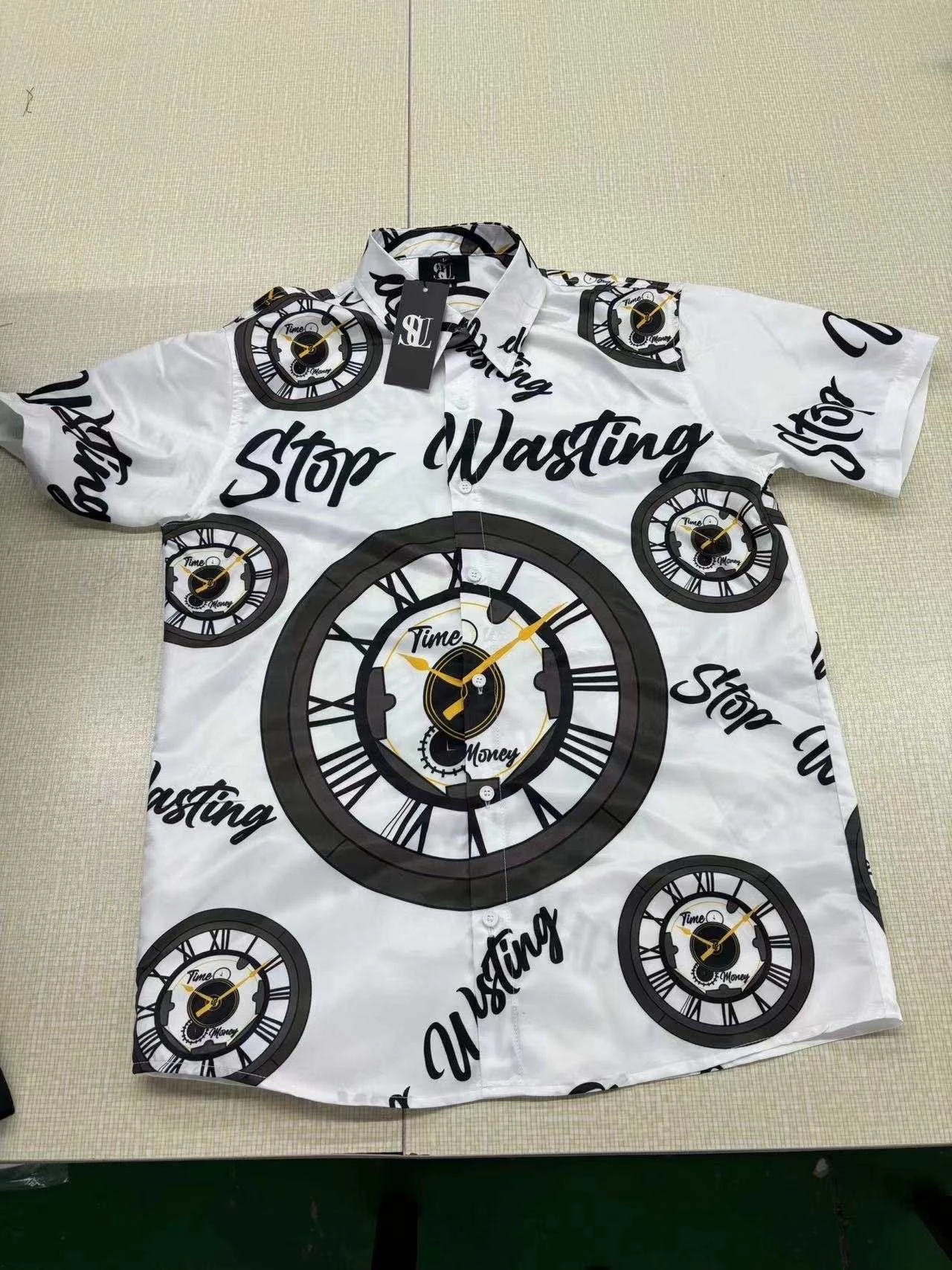 White short sleeve shirt with clock artwork and Stop Wasting lettering